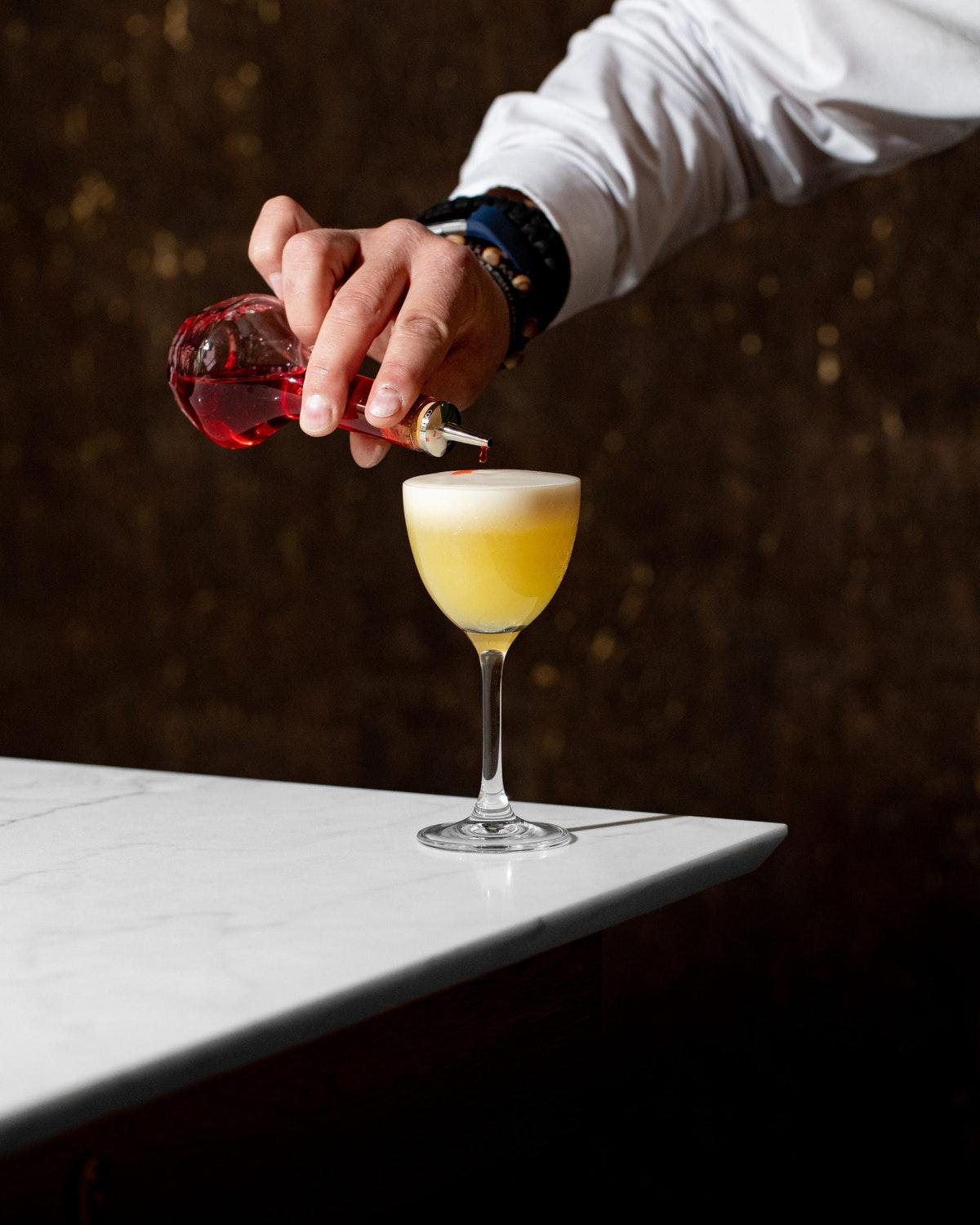 Middle Eight - Covent Garden - Preferred Hotels And Resorts London Exteriör bild A bartender topping a cocktail with a dash of Angostura Aromatic Bitters